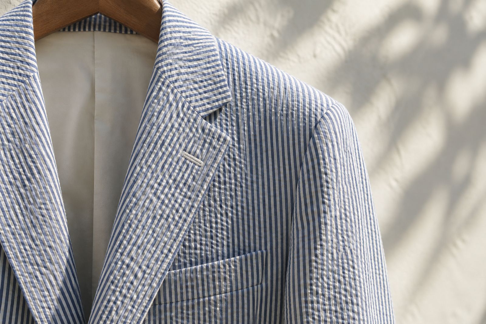 Close-up of a blue-and-white seersucker jacket.